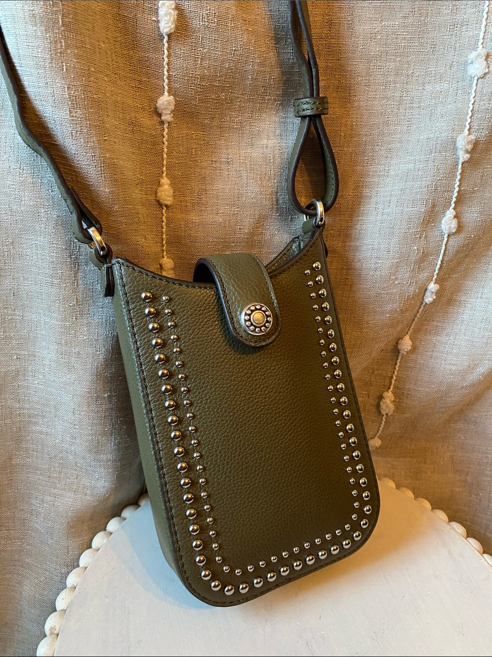 Brighton’s Olive Green Pretty Tough Studded Crossbody Phone Pouch